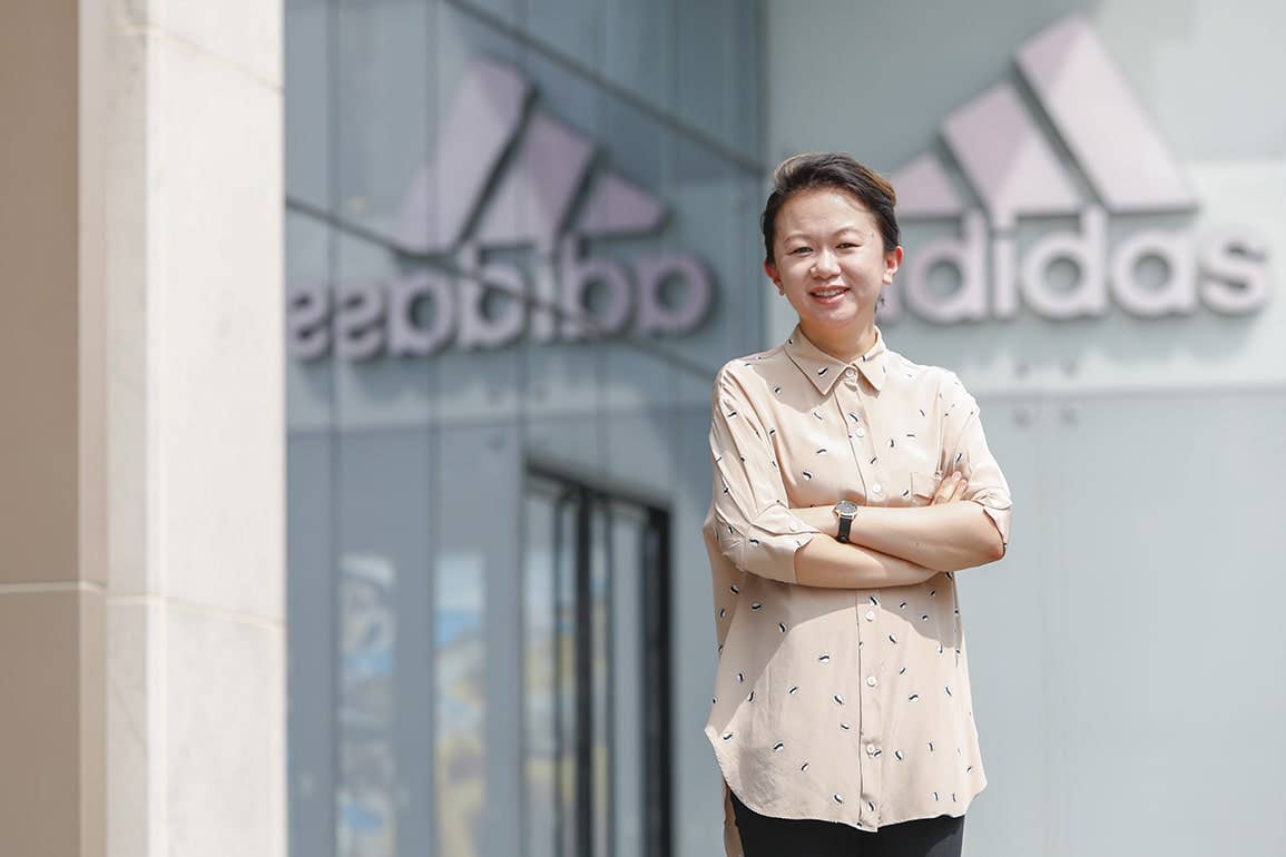 UTS College Alumni folding hands and smiling